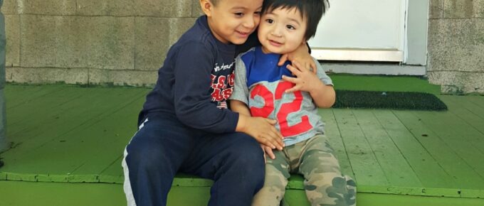 Martin and Angel play on the front porch of their new home and pose for a quick photo.