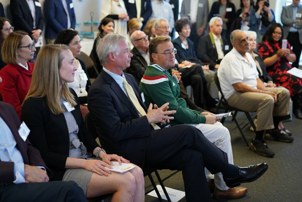 Rick Graber, Bradley Foundation CEO, seated with guests